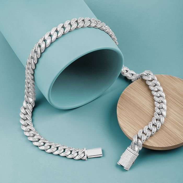 Delicate silver bracelet showcased on a turquoise background, ideal for jewelry enthusiasts.