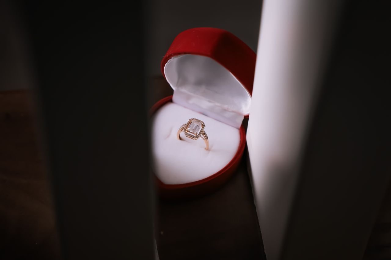 Promise Rings Close-up of a stunning diamond ring in a red velvet box, capturing elegance and romance.