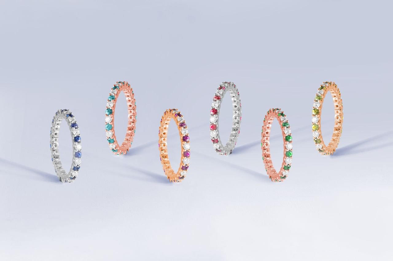 Personalized Jewelry A stunning collection of elegant, vibrant gemstone rings in a studio setting.