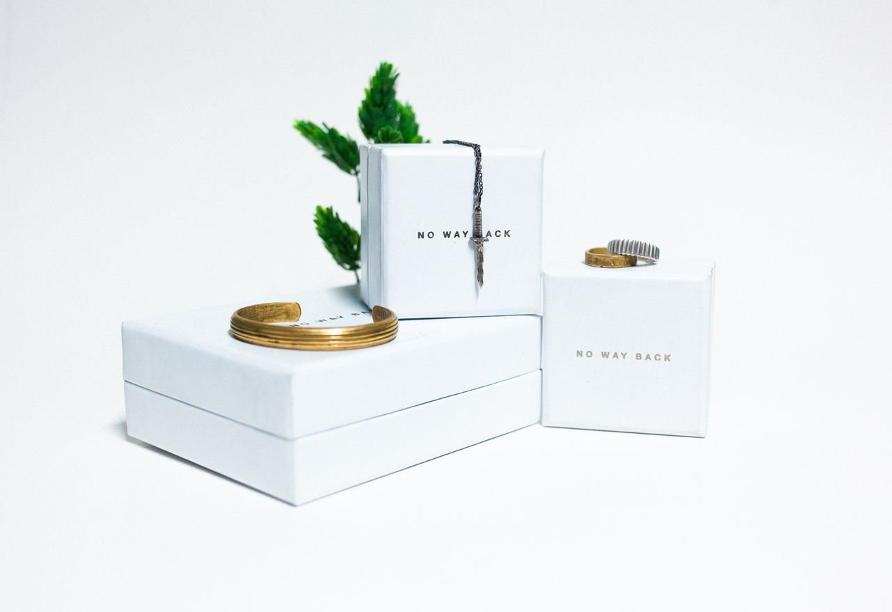 Personalized Jewelry Minimalist display featuring elegant jewelry on white boxes, ideal for upscale presentations.
